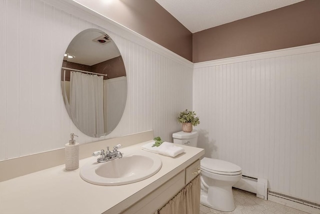 full bath with a baseboard heating unit, toilet, and vanity