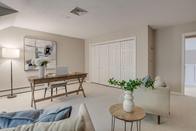 office space with light carpet, baseboards, visible vents, baseboard heating, and a textured ceiling