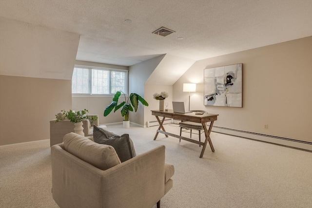 office featuring vaulted ceiling, visible vents, baseboard heating, and light colored carpet