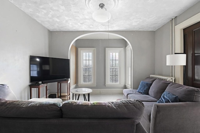 living room featuring baseboards