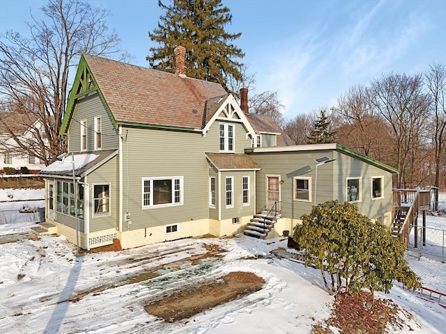 view of front of property featuring a sunroom