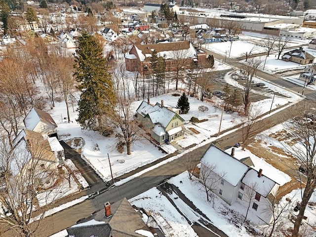 snowy aerial view featuring a residential view