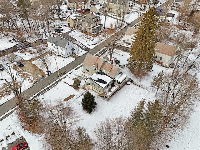 snowy aerial view featuring a residential view