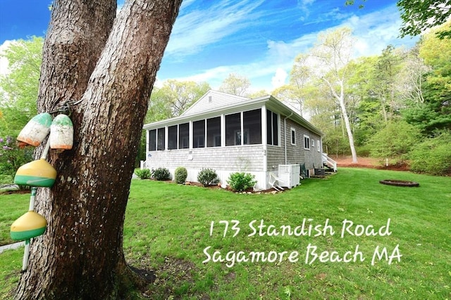 173 Standish Rd, Bourne, MA 02562 - view of side of property featuring a sunroom and a yard