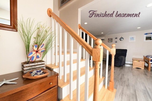 173 Standish Rd, Bourne, MA 02562 - stairway with wood finished floors, recessed lighting, and a wall unit AC