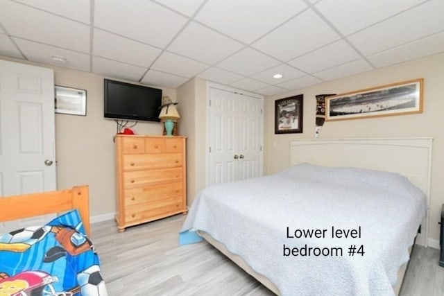 173 Standish Rd, Bourne, MA 02562 - bedroom featuring a drop ceiling, wood finished floors, baseboards, and a closet