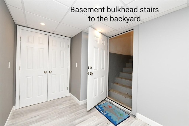 173 Standish Rd, Bourne, MA 02562 - entrance foyer with a drop ceiling, baseboards, light wood-style flooring, stairs, and recessed lighting