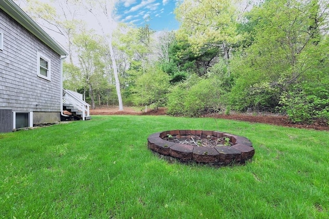 173 Standish Rd, Bourne, MA 02562 - view of grassy yard with a fire pit