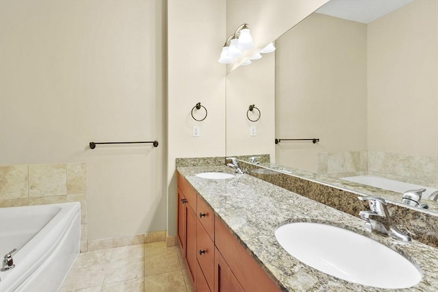 bathroom featuring a garden tub, baseboards, double vanity, and tile patterned flooring