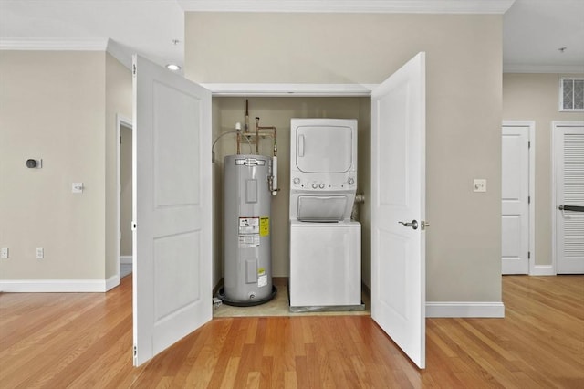 utilities with estacked washer and dryer and water heater
