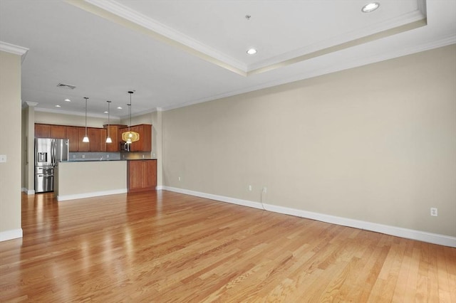 unfurnished living room featuring light wood-type flooring, recessed lighting, crown molding, and baseboards