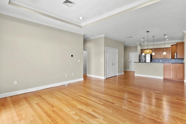 unfurnished living room with light wood finished floors, crown molding, recessed lighting, and baseboards
