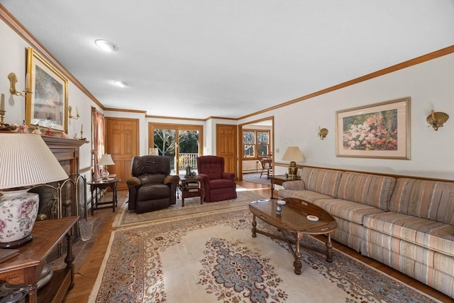 living room with hardwood / wood-style flooring and ornamental molding