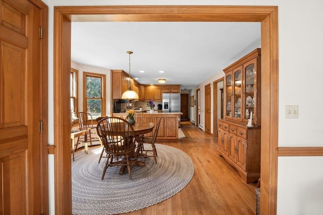 dining room with light hardwood / wood-style floors