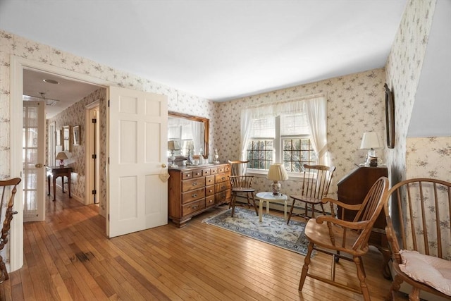 living area with hardwood / wood-style floors