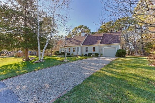 view of front facade featuring a garage and a front lawn