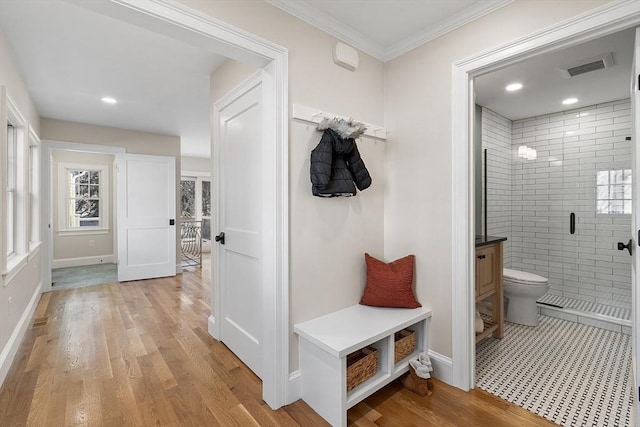 mudroom featuring light hardwood / wood-style floors and ornamental molding