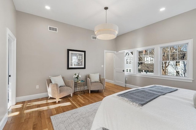 bedroom with hardwood / wood-style flooring