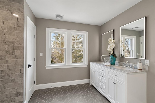 bathroom with vanity and plenty of natural light