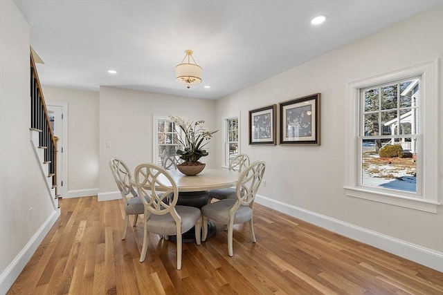 dining room with light hardwood / wood-style flooring