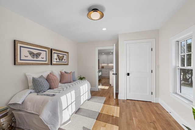 bedroom with light hardwood / wood-style floors