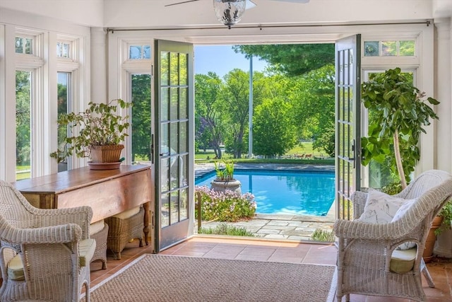 doorway to outside with tile patterned flooring and plenty of natural light