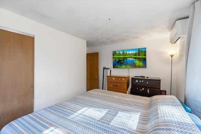 bedroom featuring an AC wall unit