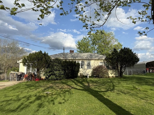 view of yard featuring a detached carport