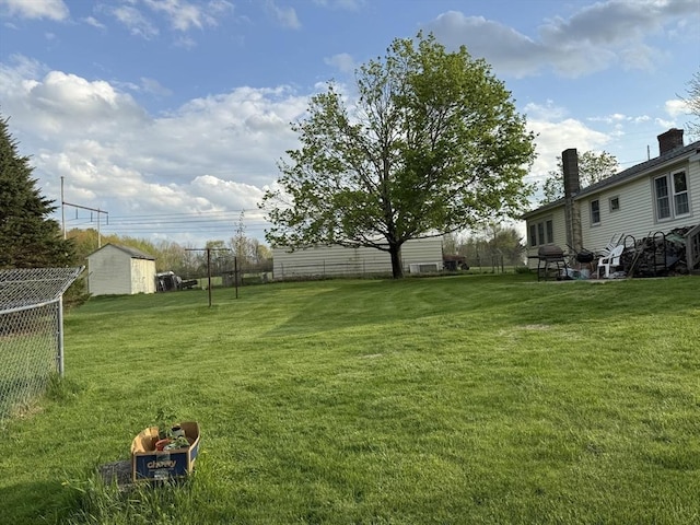 view of yard with a storage unit and an outdoor structure