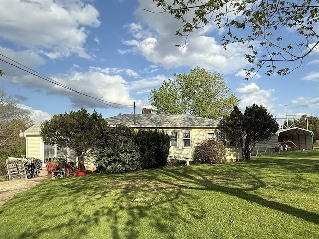 view of yard featuring a detached carport