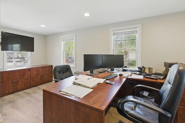 office area with light wood-style flooring, a healthy amount of sunlight, and recessed lighting