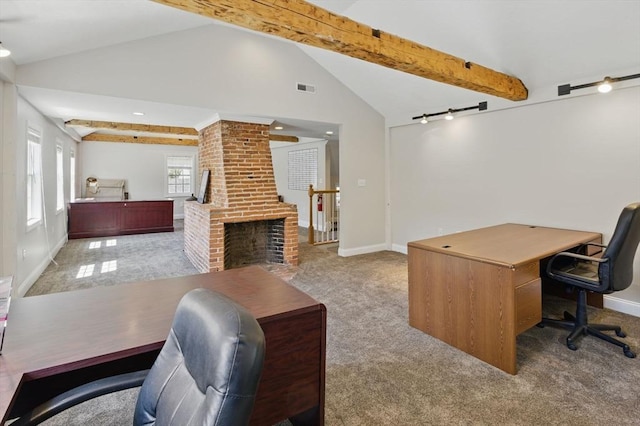 office with rail lighting, lofted ceiling with beams, baseboards, and visible vents