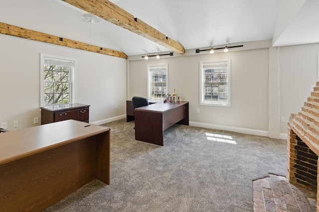 home office featuring carpet, plenty of natural light, baseboards, and beamed ceiling