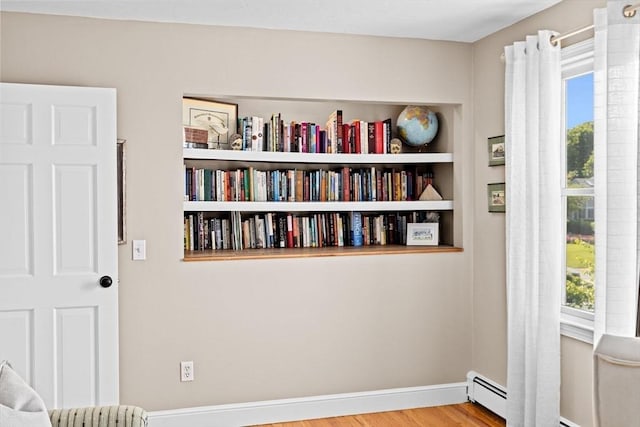 5 Cliff Estates Rd, Scituate, MA 02066 - unfurnished room featuring a baseboard heating unit and wood finished floors