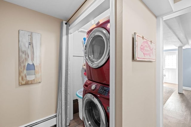 5 Cliff Estates Rd, Scituate, MA 02066 - washroom with stacked washer / dryer, a baseboard heating unit, and wood finished floors
