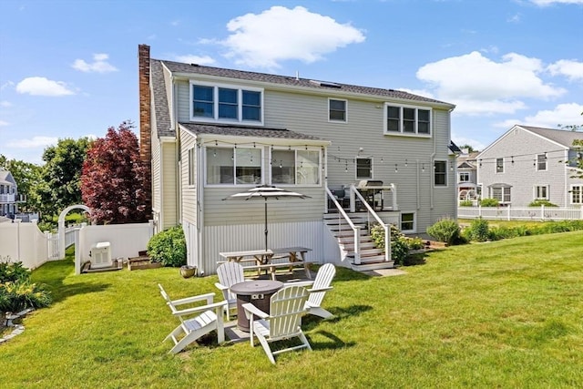 5 Cliff Estates Rd, Scituate, MA 02066 - back of property with a chimney, stairway, and a wooden deck