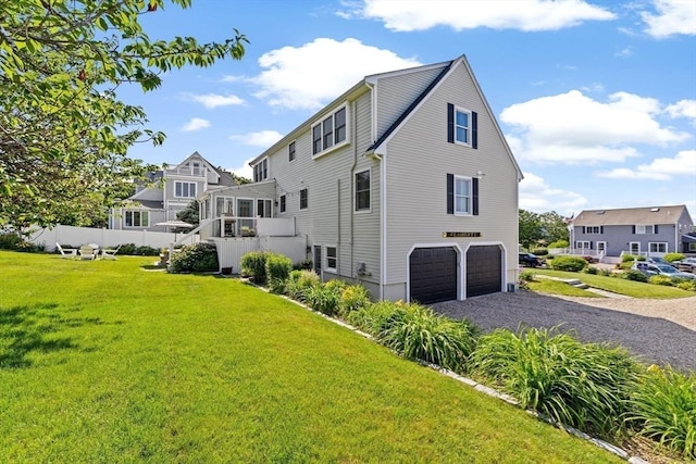 5 Cliff Estates Rd, Scituate, MA 02066 - back of property with a garage, driveway, a lawn, and a residential view