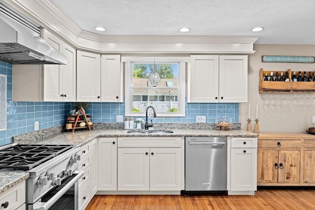 5 Cliff Estates Rd, Scituate, MA 02066 - kitchen with appliances with stainless steel finishes, range hood, light stone countertops, white cabinets, and light wood finished floors