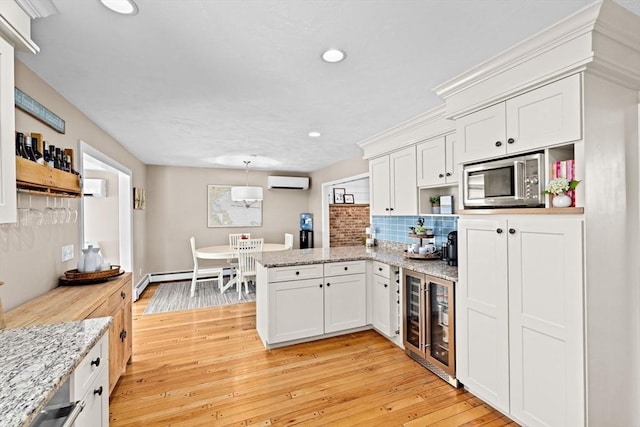 5 Cliff Estates Rd, Scituate, MA 02066 - kitchen featuring an AC wall unit, open shelves, wine cooler, a peninsula, and recessed lighting