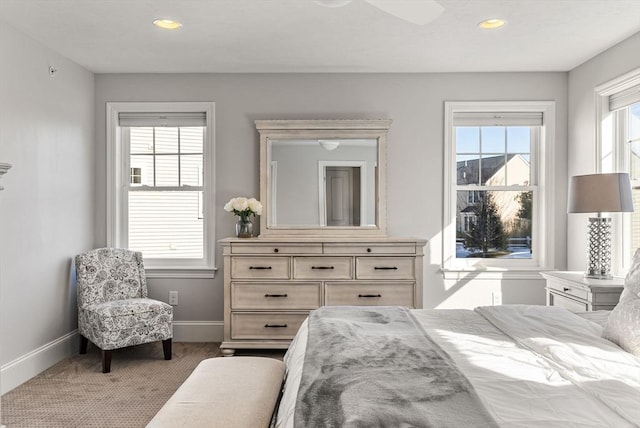 bedroom with multiple windows, baseboards, and recessed lighting