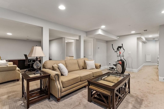 living room with visible vents, baseboards, light colored carpet, and recessed lighting