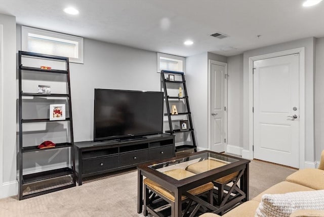 carpeted living area with baseboards, visible vents, and recessed lighting