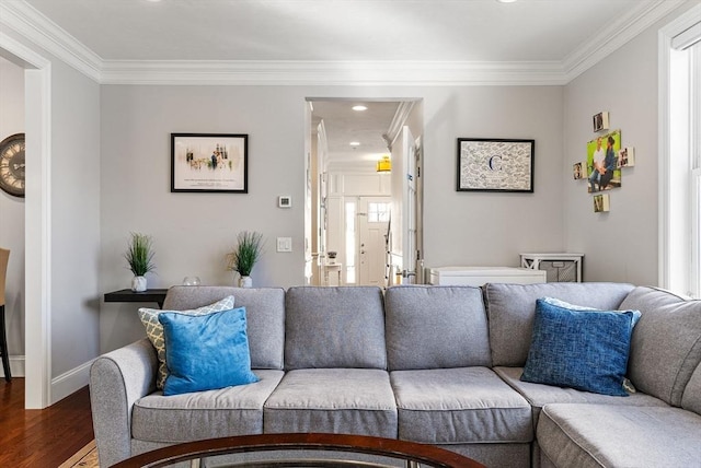 living room with recessed lighting, crown molding, baseboards, and wood finished floors