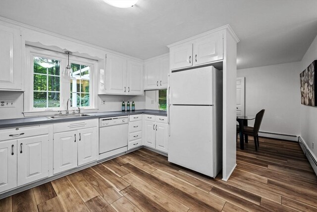 10 High Ridge Rd, Boxford, MA 01921 - kitchen featuring white appliances, dark countertops, dark wood-style flooring, white cabinetry, and a baseboard radiator