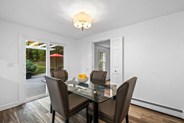 10 High Ridge Rd, Boxford, MA 01921 - dining space featuring a baseboard radiator, a chandelier, plenty of natural light, and wood finished floors