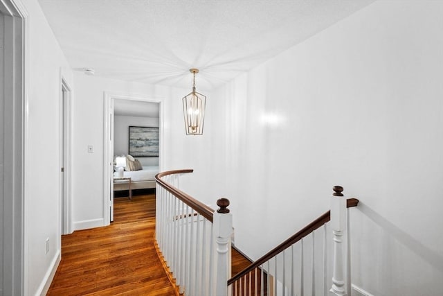 10 High Ridge Rd, Boxford, MA 01921 - hall with an upstairs landing, wood finished floors, and a chandelier