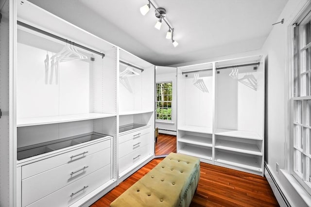 10 High Ridge Rd, Boxford, MA 01921 - spacious closet featuring a baseboard radiator and dark wood-style flooring