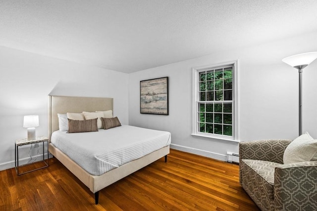 10 High Ridge Rd, Boxford, MA 01921 - bedroom with baseboard heating and wood finished floors