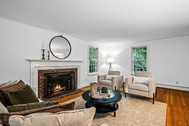 10 High Ridge Rd, Boxford, MA 01921 - living room featuring a baseboard heating unit, a fireplace, and wood finished floors