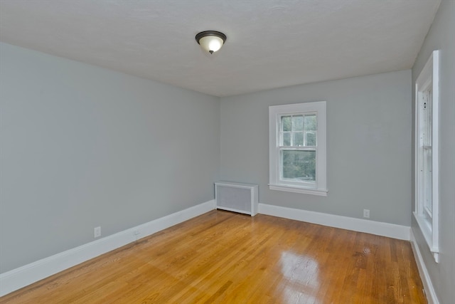 spare room with hardwood / wood-style flooring